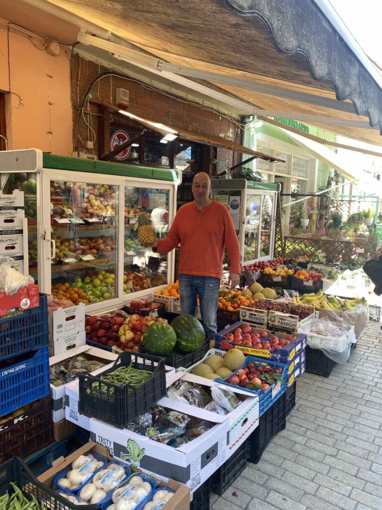 Charalambos Kontogirgis in front of his retail grocery chop.